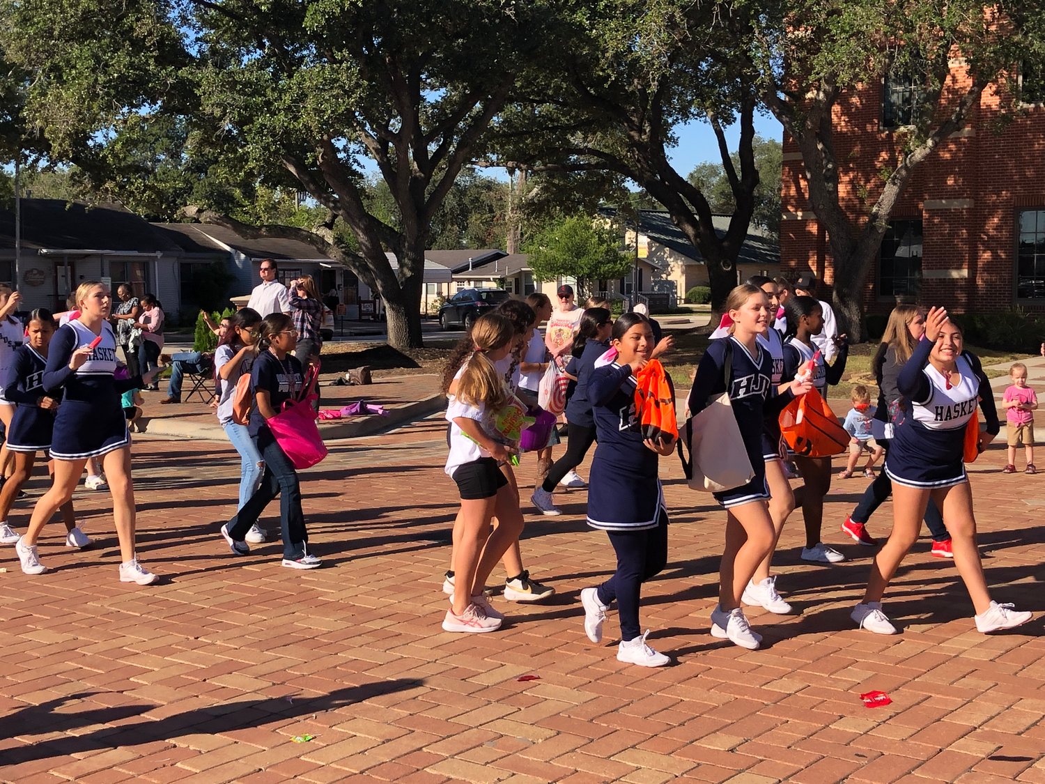 The Haskett Junior High cheerleaders enjoy their parade walk.
